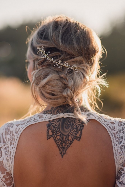 bride open back dress with tattoo and hair detail