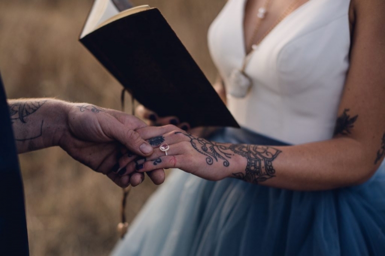 adventurous couple reading vows during elopement