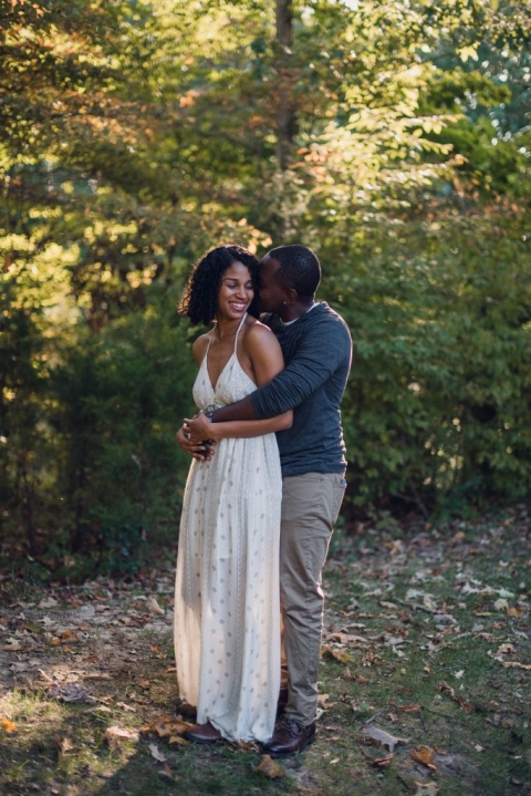 couple hugging during adventure session in virginia
