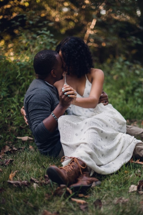 couple kissing during adventure session in virginia