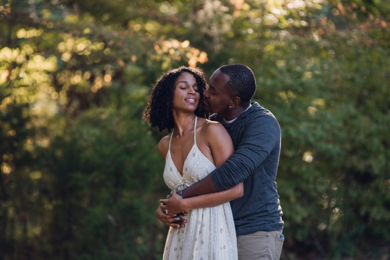 couple snuggling during adventure session in virginia