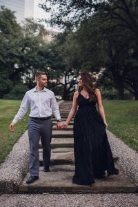 engagement couple walking down stairs