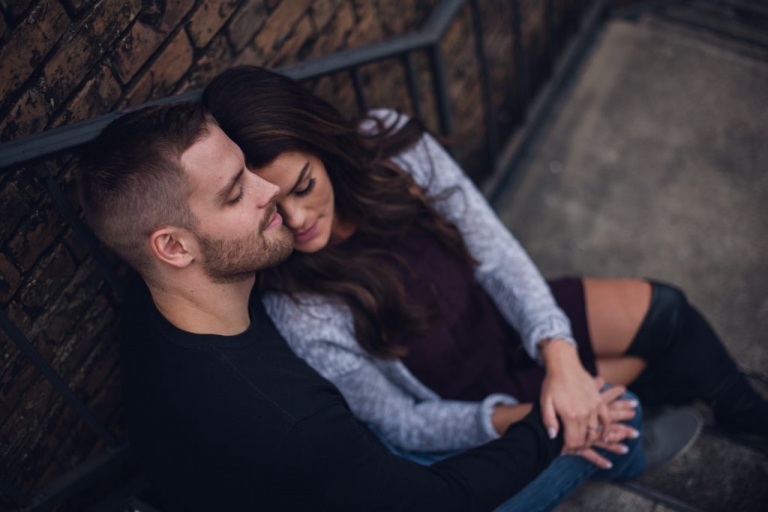 engagement couple snuggling