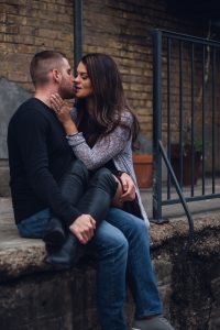 engagement couple kissing