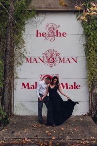 engagement couple in front of mural