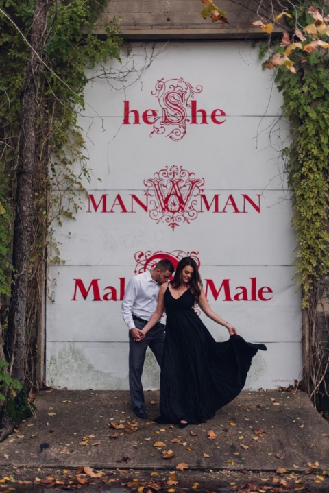 engagement couple in front of mural