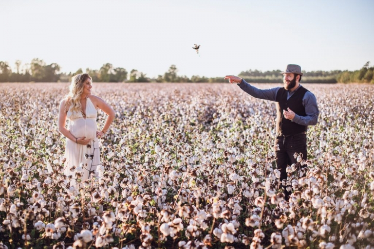 couples adventure session in cotton field