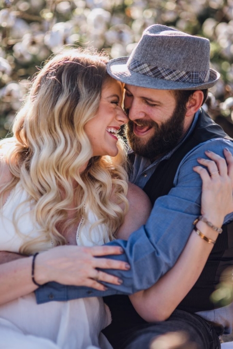 adventurous couple snuggling during session