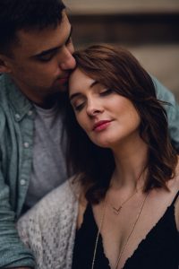 couple relaxing with forehead kiss