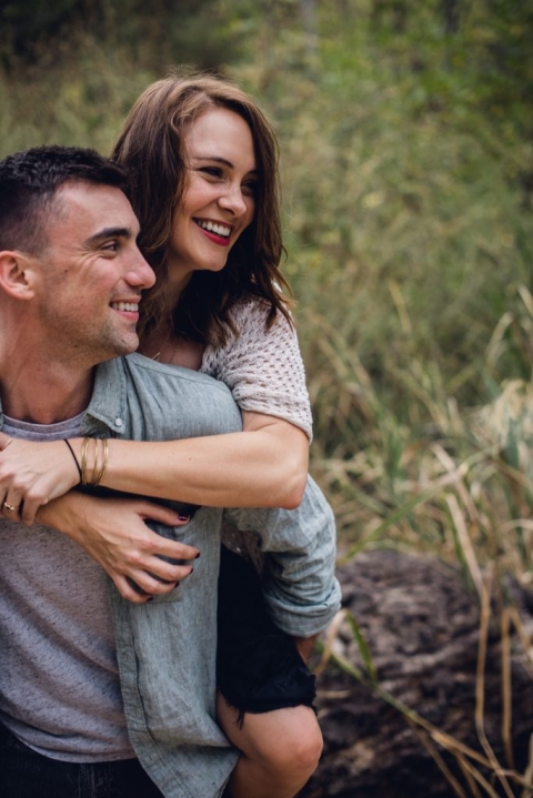 adventurous couple piggy back ride