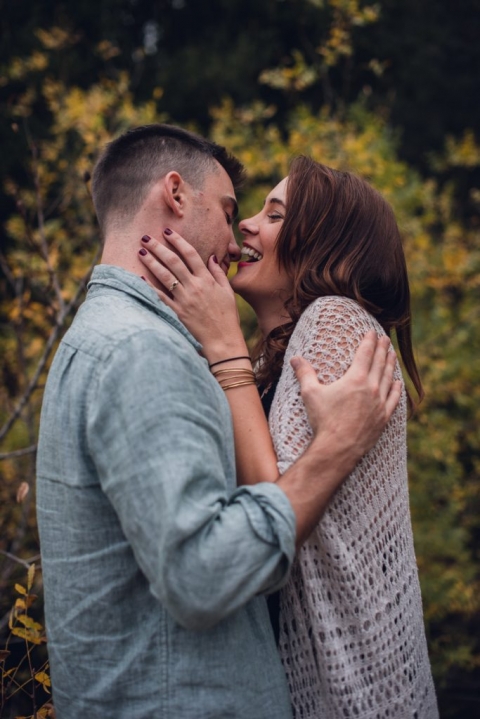 adventurous couple laughing and embracing