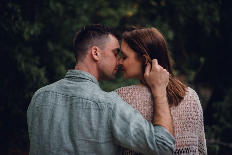 adventurous couple sharing a kiss