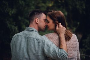 adventurous couple sharing a kiss