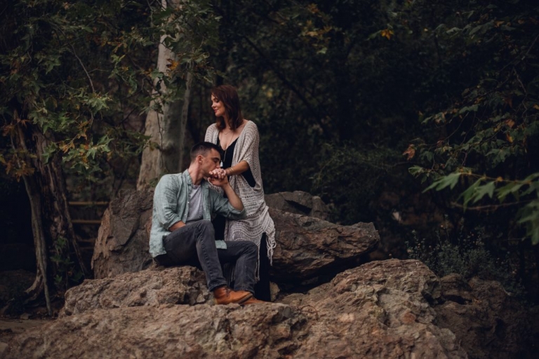 adventurous couple sitting in nature