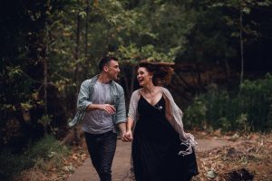 adventurous couple running and laughing
