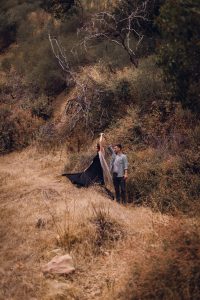 adventurous couple dancing in nature