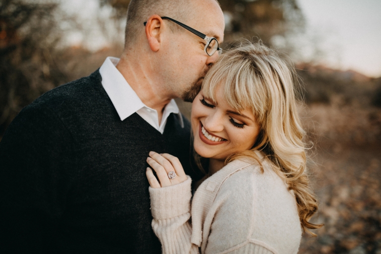 adventurous couple embracing in the desert