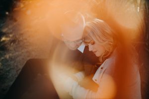 adventurous couple embracing in the desert