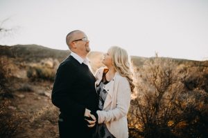 adventurous couple dancing in the desert