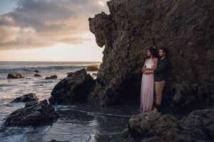 adventurous couple watching the sunset during a couples session