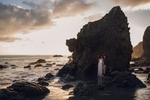 adventurous couple watching the sunset during a couples session