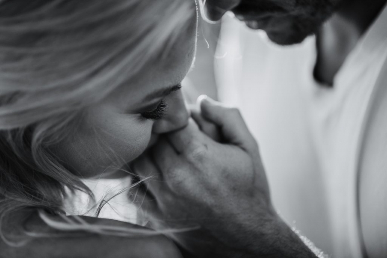 adventurous couple embracing on ruby beach