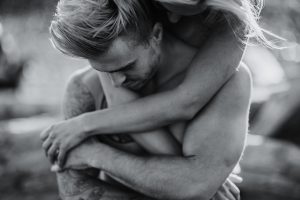 adventurous couple embracing on ruby beach