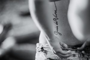 joie de vivre script back tattoo