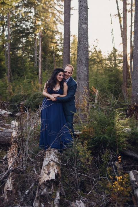 adventurous couple embracing in the woods during olympic national park engagement session