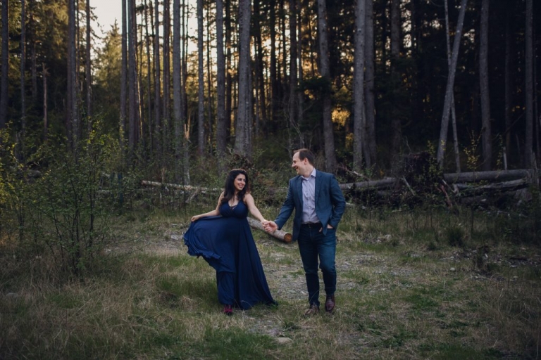adventurous couple walking in the woods during olympic national park engagement session