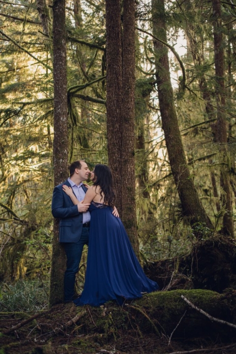 adventurous couple embracing in the woods during olympic national park engagement session