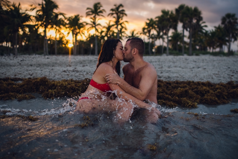 honeymoon couple in miami beach kiss in water