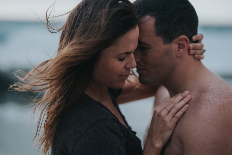 honeymoon couple embracing in hawaii