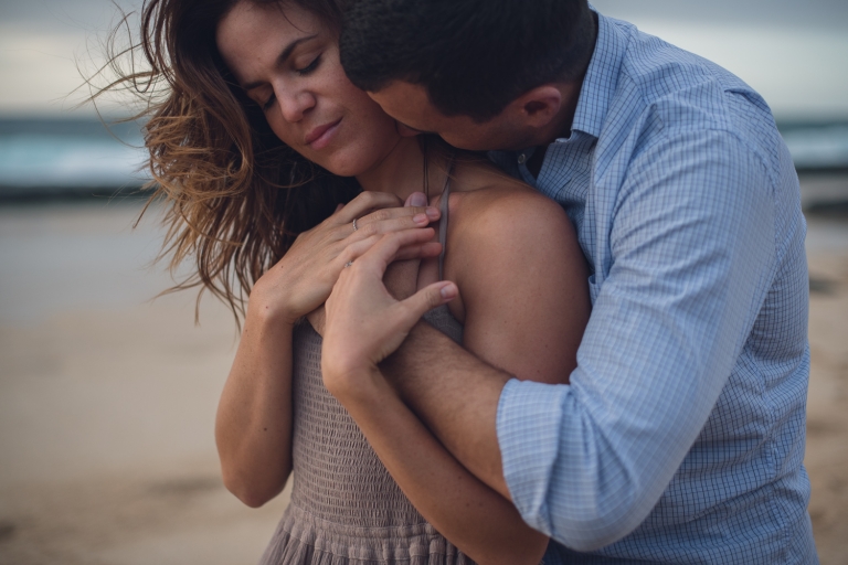 honeymoon couple embracing in hawaii