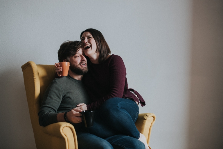 snuggle session, lifestyle photo session, in-home photo session, couples, couples lifestyle photo session, love, couples lifestyle photographer, yellow chair, coffee together