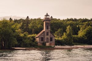 Michigan's Pictured Rocks on Lake Superior, East Channel Lighthouse, mineral stain, cliffs, midwest, great lakes, sunset, boat tours, summertime, lake water, upper peninsula, UP Michigan, Michigan, Lake Superior, pictured rocks, greenery, great lakes, midwest