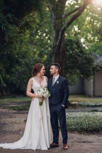 intimate summer elopement, Rothko chapel, Houston intimate elopement, Texas intimate elopement photographer, navy blue suit, sleeveless wedding dress, summer wedding, greenery, bride and groom, just married