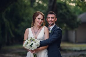 intimate summer elopement, Rothko chapel, Houston intimate elopement, Texas intimate elopement photographer, navy blue suit, sleeveless wedding dress, summer wedding, greenery, bride and groom, just married