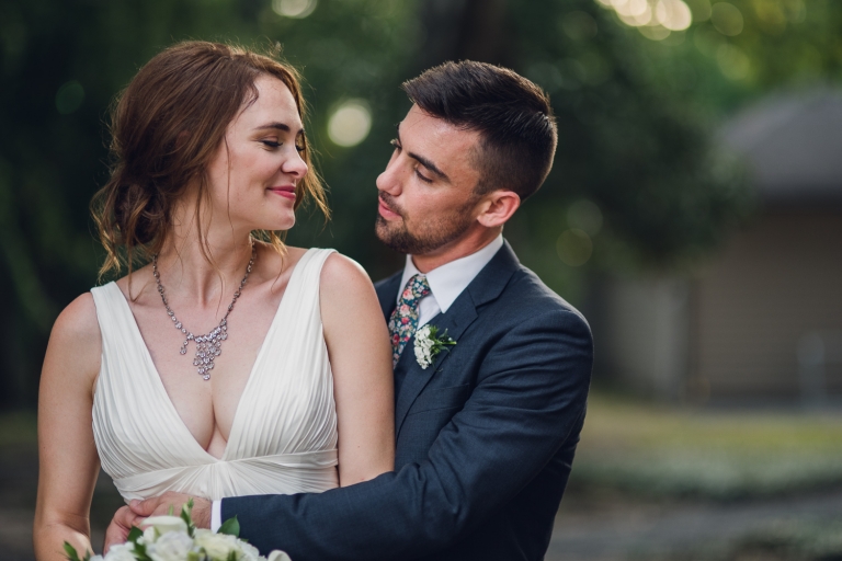 intimate summer elopement, Rothko chapel, Houston intimate elopement, Texas intimate elopement photographer, navy blue suit, sleeveless wedding dress, summer wedding, greenery, bride and groom, just married