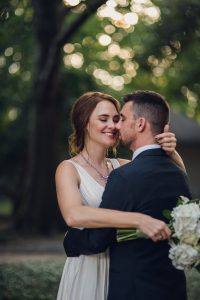 intimate summer elopement, Rothko chapel, Houston intimate elopement, Texas intimate elopement photographer, navy blue suit, sleeveless wedding dress, summer wedding, greenery, bride and groom, just married