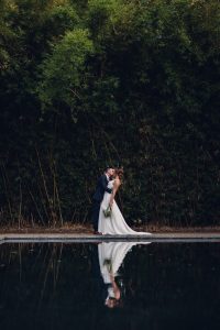 intimate summer elopement, Rothko chapel, Houston intimate elopement, Texas intimate elopement photographer, navy blue suit, sleeveless wedding dress, summer wedding, greenery